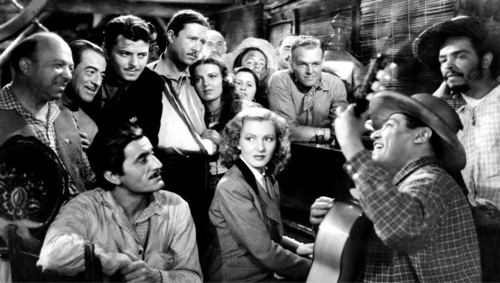Jean Arthur og Cary Grant med heile gjengen i frå filmen Only Angels Have Wings (1939).