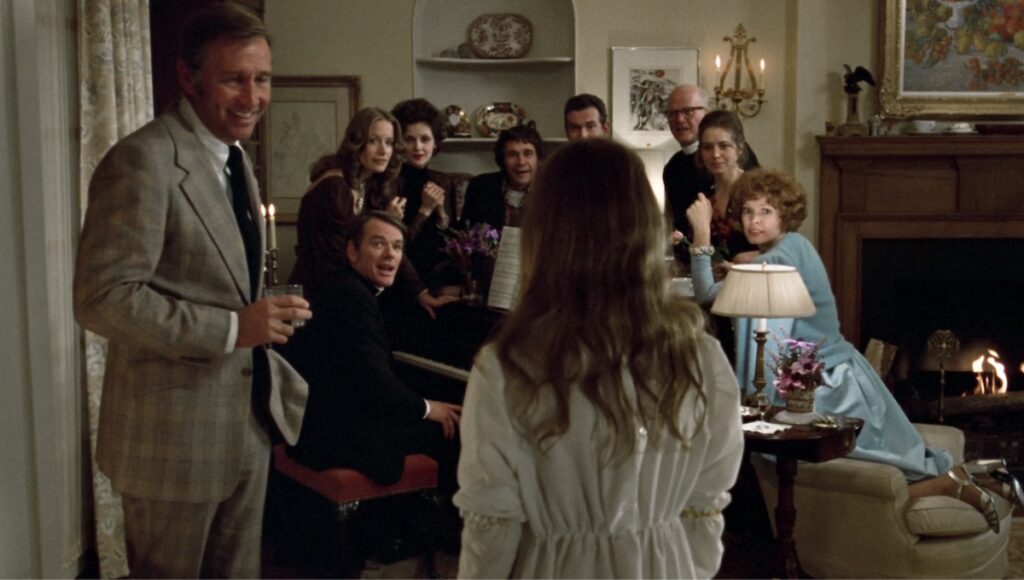 Selskapet som blir sjokkerte av Linda Blair frå skrekkfilmen The Exorcist (1973).
